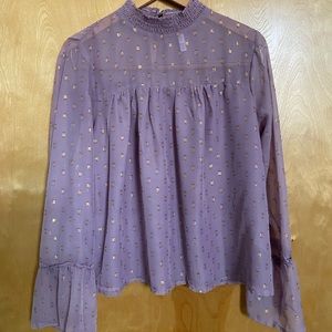 Sheer lavender short waisted blouse.
